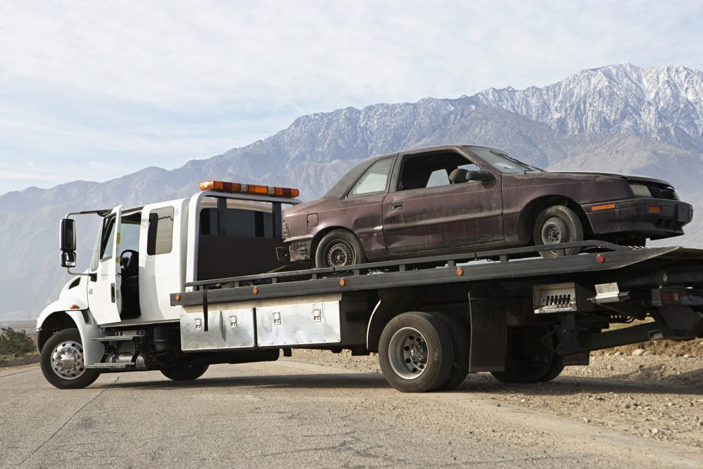 Damaged Car On Trailer